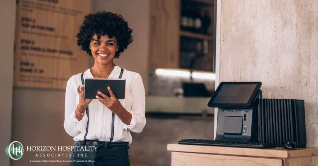 Restaurant worker using technology
